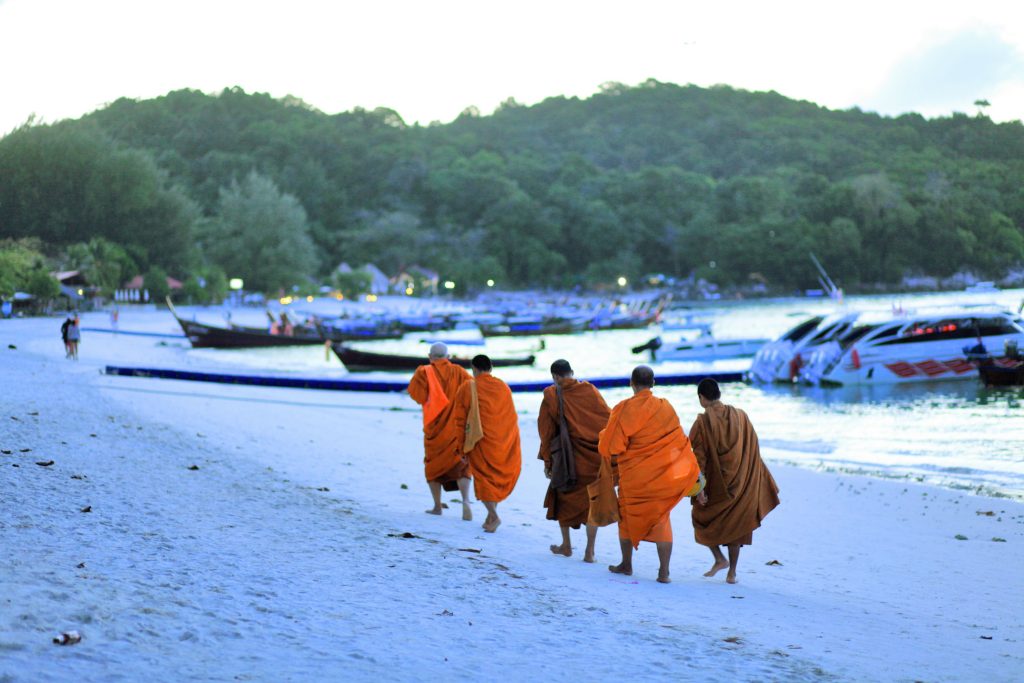 Making merit by offering food to monks by the beach with Akira Lipe